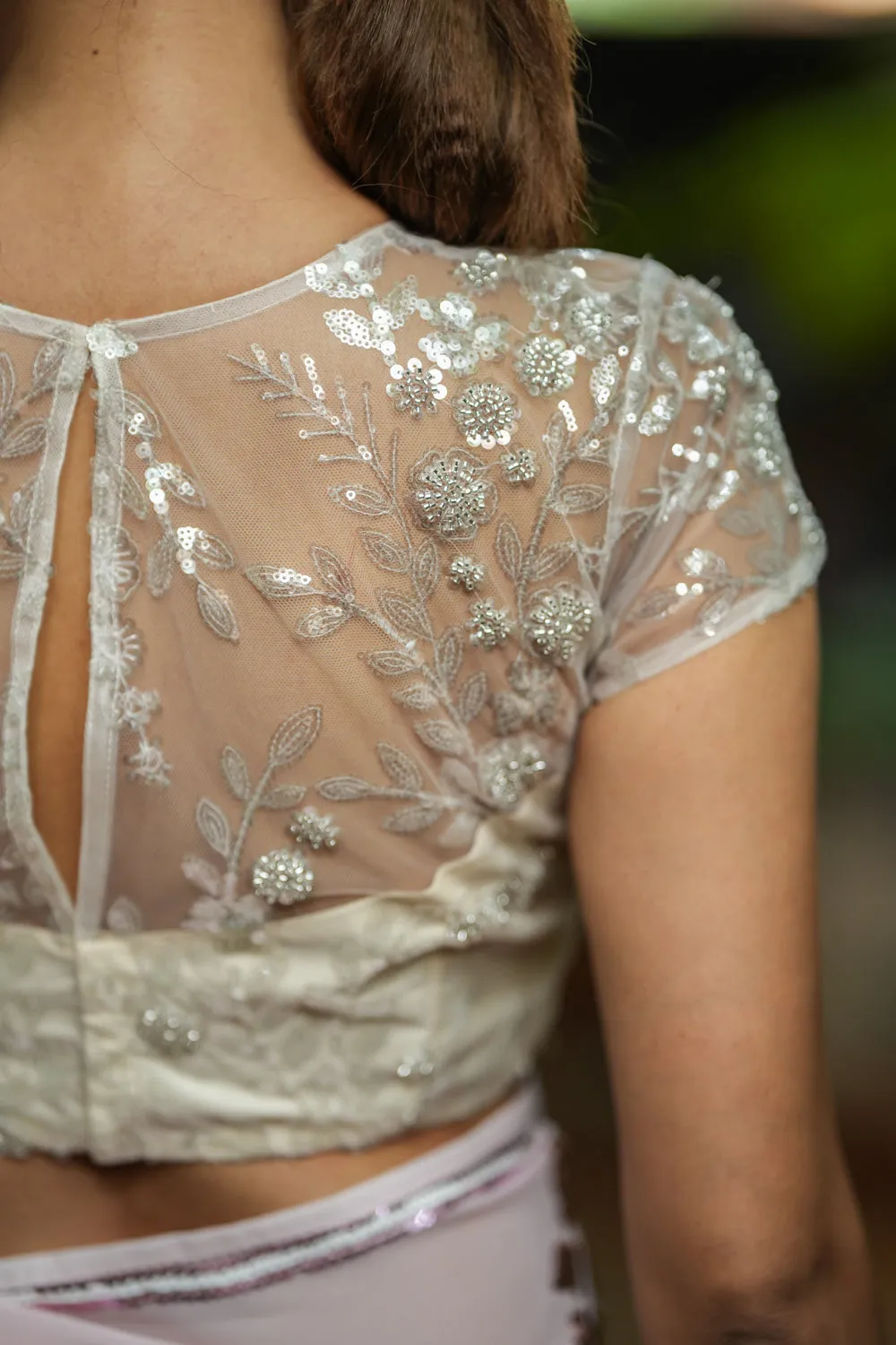 White Net Blouse with Sheer Yoke and ShimmeringFloral Design Sequins